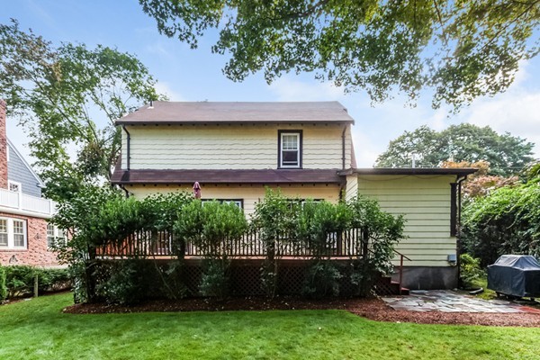 104 Cutter Hill Road Arlington, MA 02474 - Photo 17 of 19 a view of a house with a yard plants and a large tree
