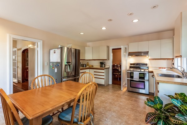 104 Cutter Hill Road Arlington, MA 02474 - Photo 7 of 19 a kitchen with granite countertop a refrigerator stove top oven and sink