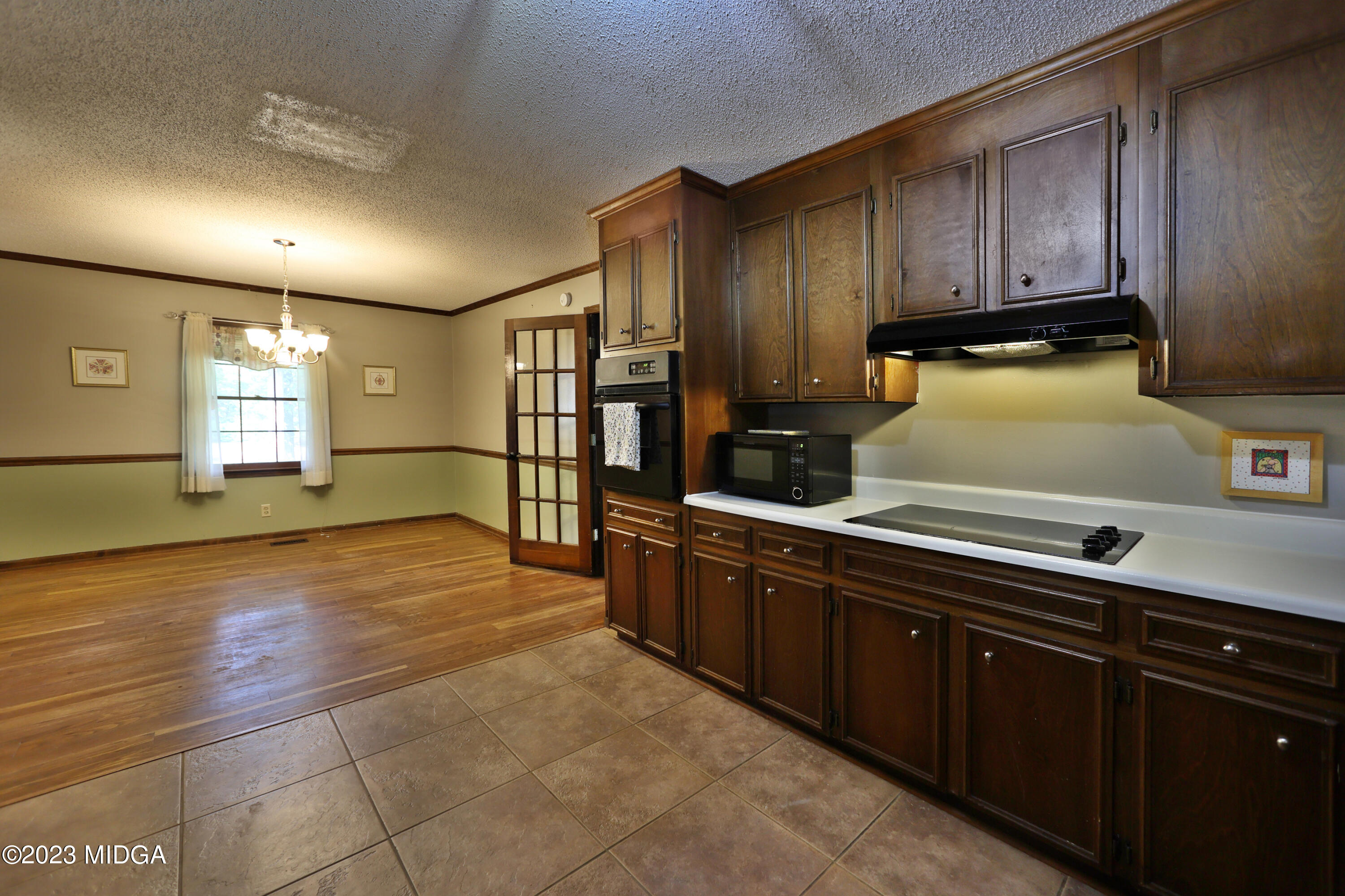 5740 Huddersfield Road Macon, GA 31210 - Photo 15 of 36 a kitchen with stainless steel appliances granite countertop a sink and cabinets