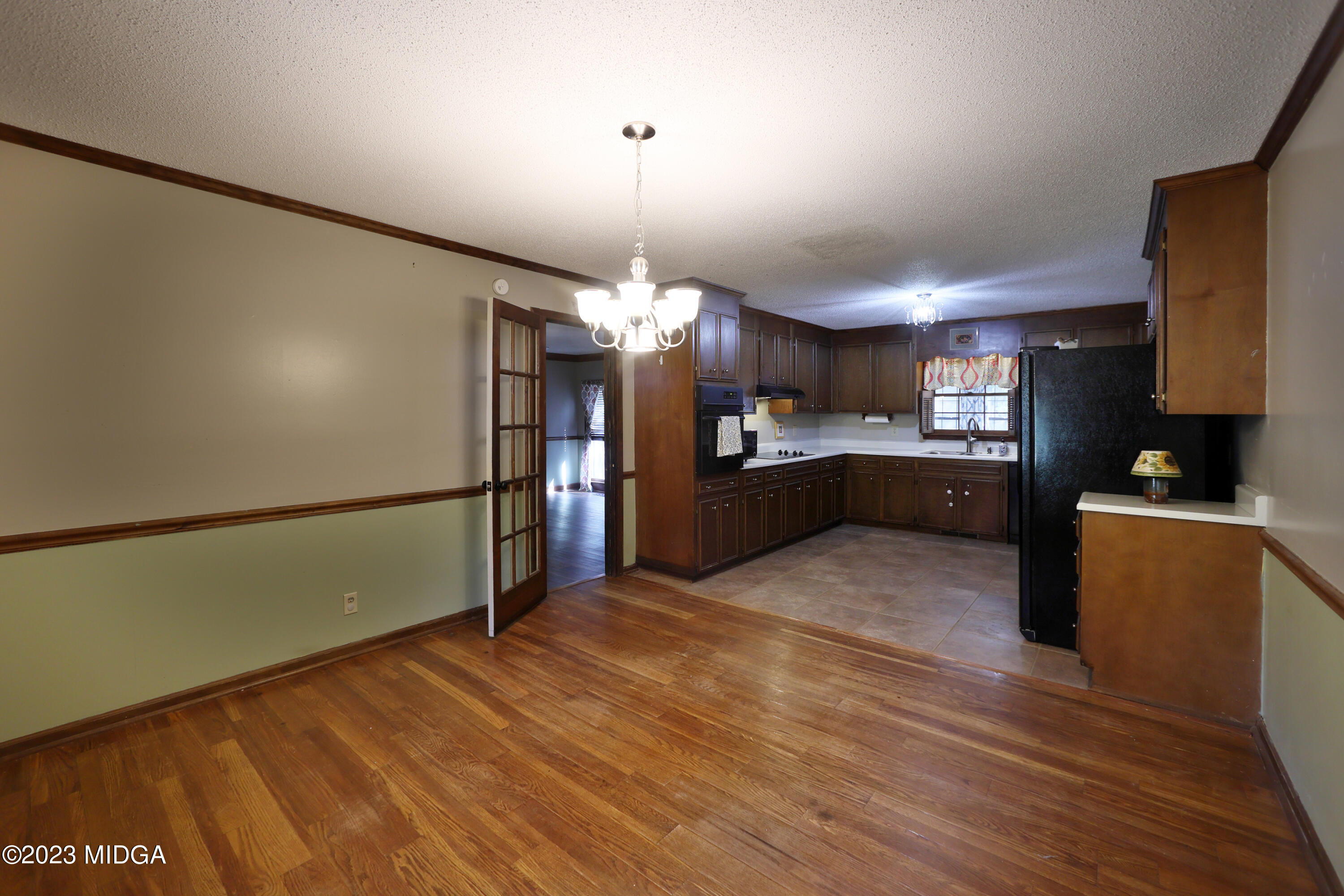 5740 Huddersfield Road Macon, GA 31210 - Photo 16 of 36 a view of a kitchen with cabinets and wooden floor