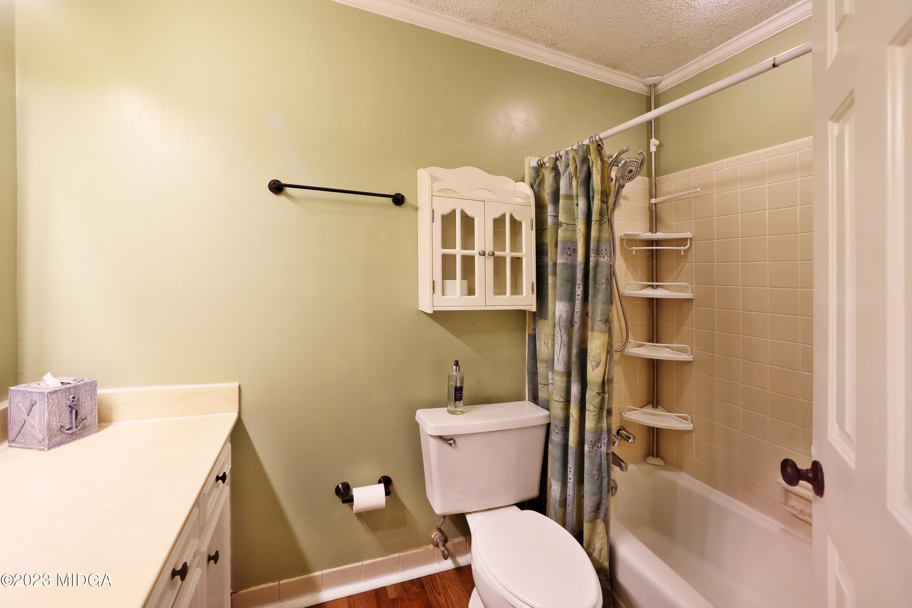 5740 Huddersfield Road Macon, GA 31210 - Photo 22 of 36 a bathroom with a sink a toilet and shower