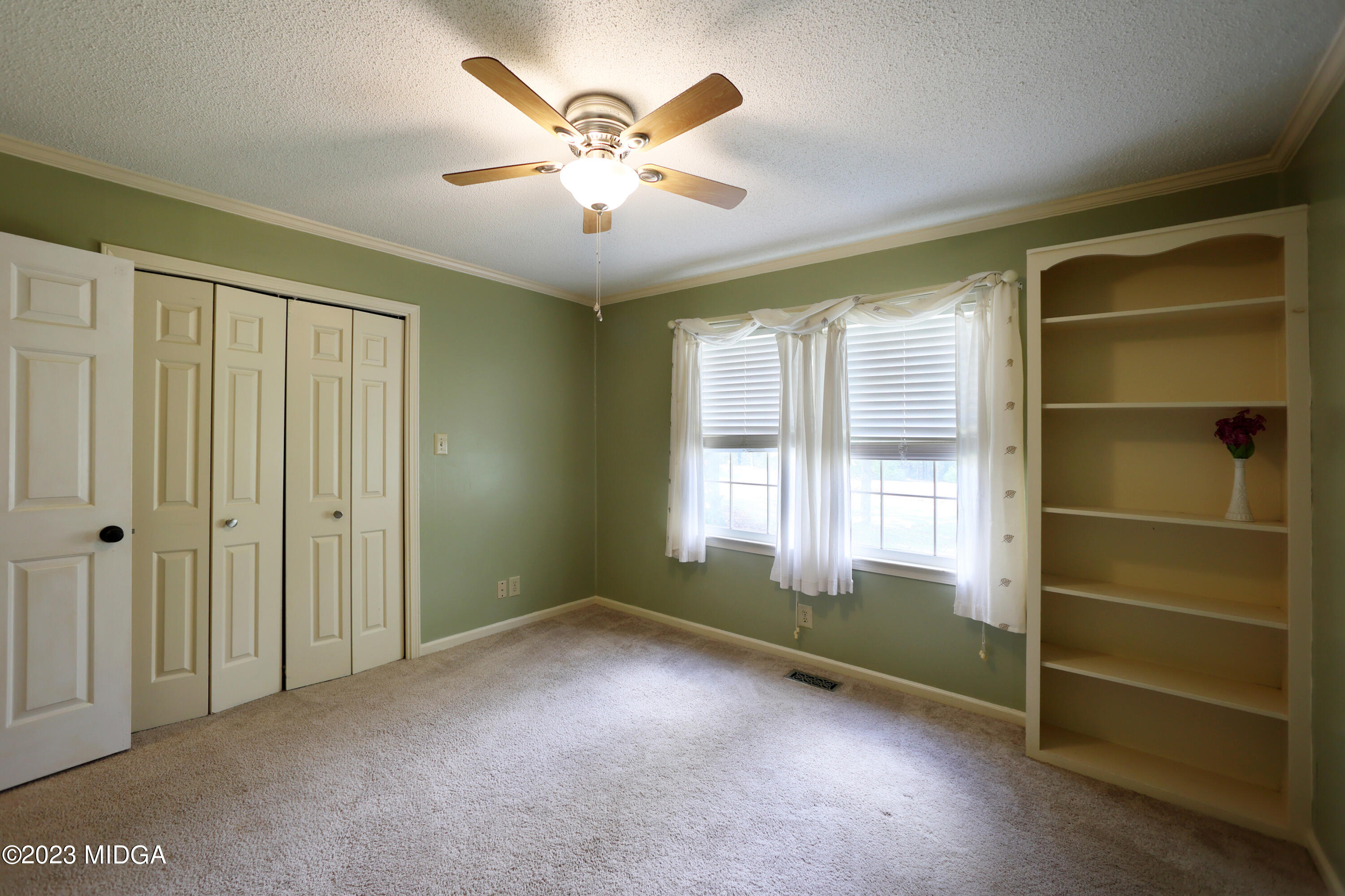 5740 Huddersfield Road Macon, GA 31210 - Photo 24 of 36 a view of an empty room with a window