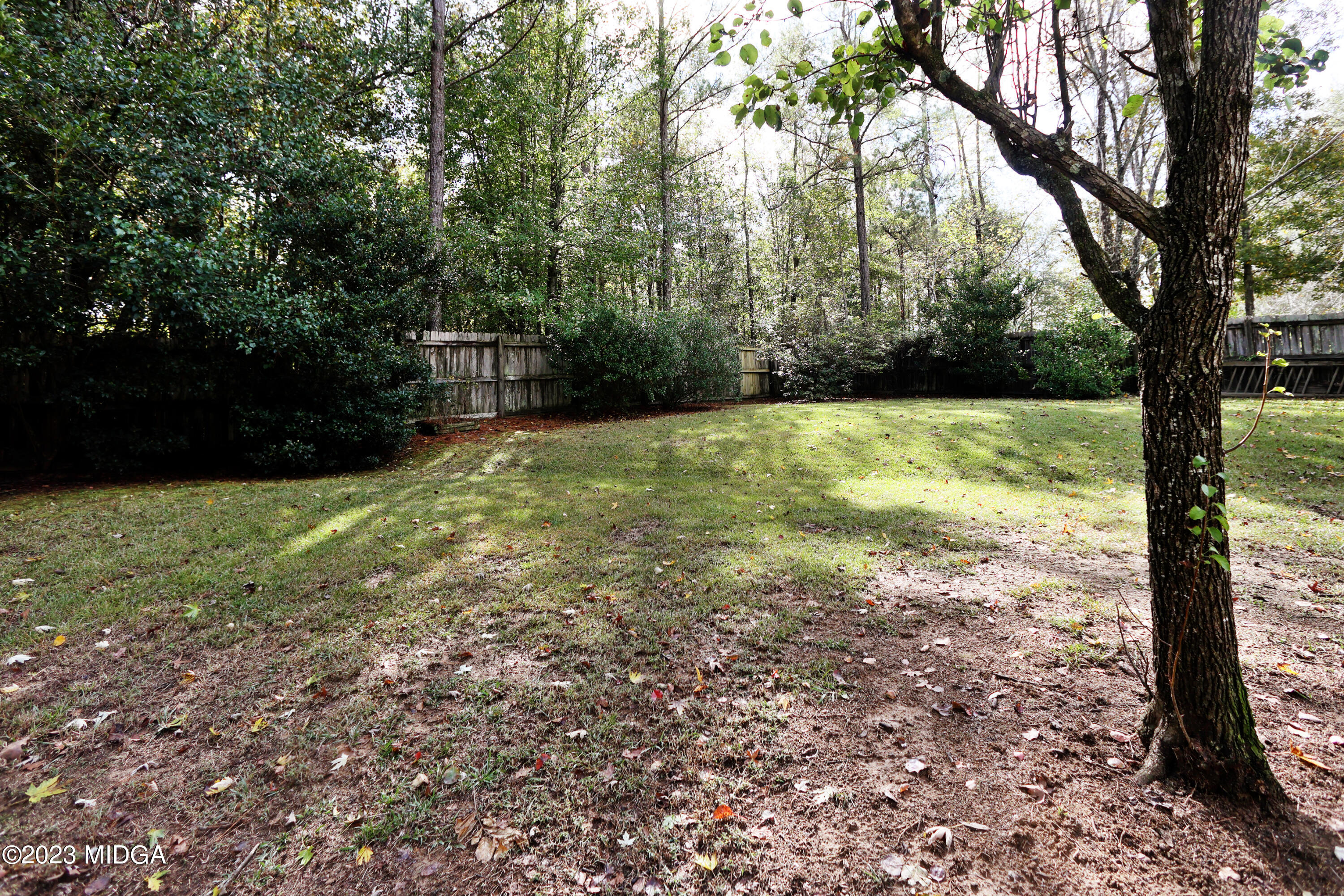 5740 Huddersfield Road Macon, GA 31210 - Photo 35 of 36 a view of a yard with large trees