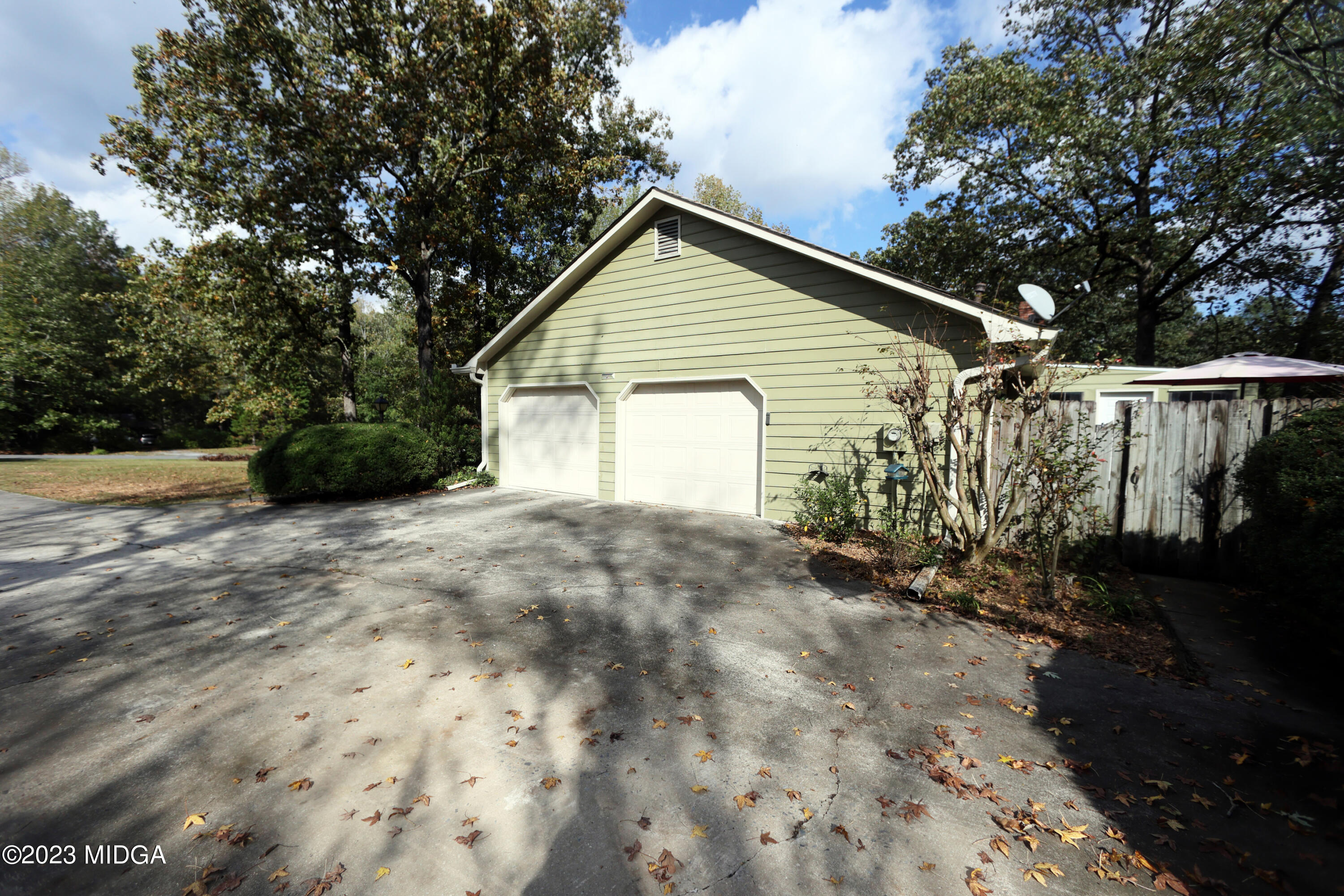 5740 Huddersfield Road Macon, GA 31210 - Photo 36 of 36 a view of a house with a yard and garage