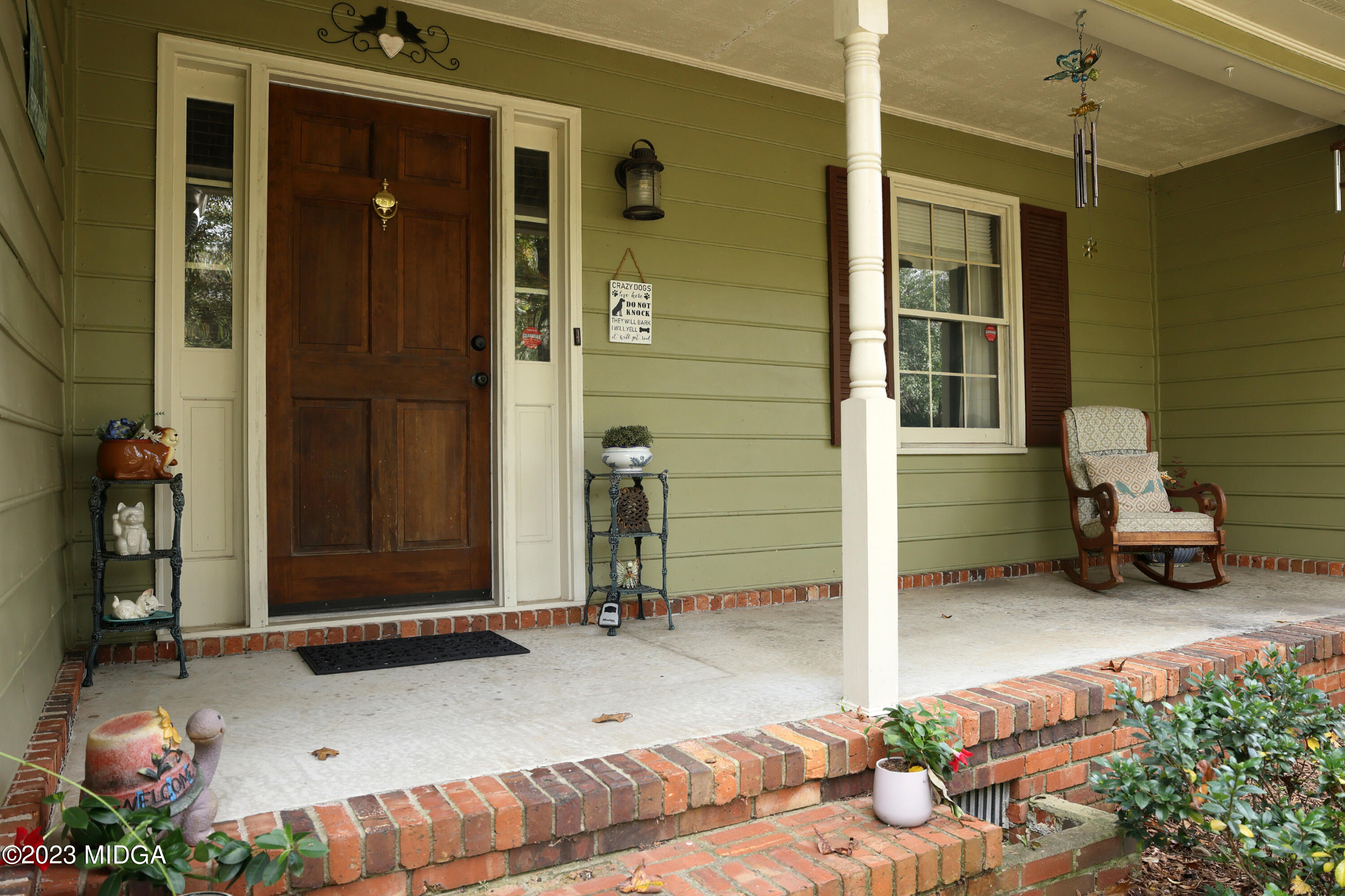 5740 Huddersfield Road Macon, GA 31210 - Photo 5 of 36 a backyard of a house with yard and outdoor seating