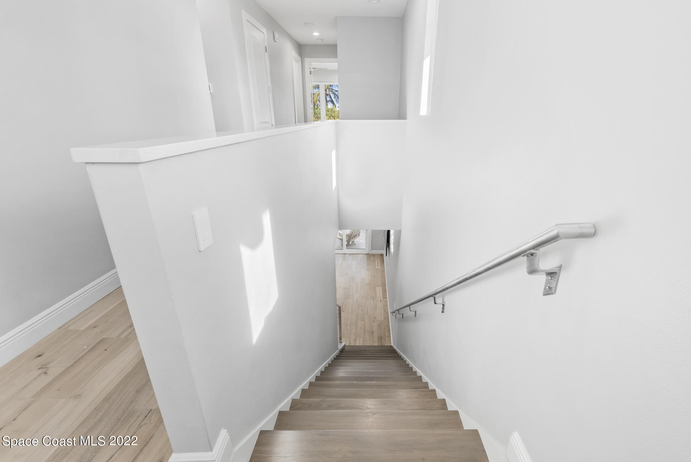 151 24th Street Cocoa Beach, FL 32931 - Photo 11 of 36 a view of a hallway with staircase