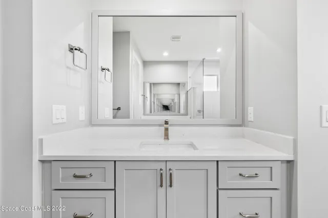a sink with a mirror