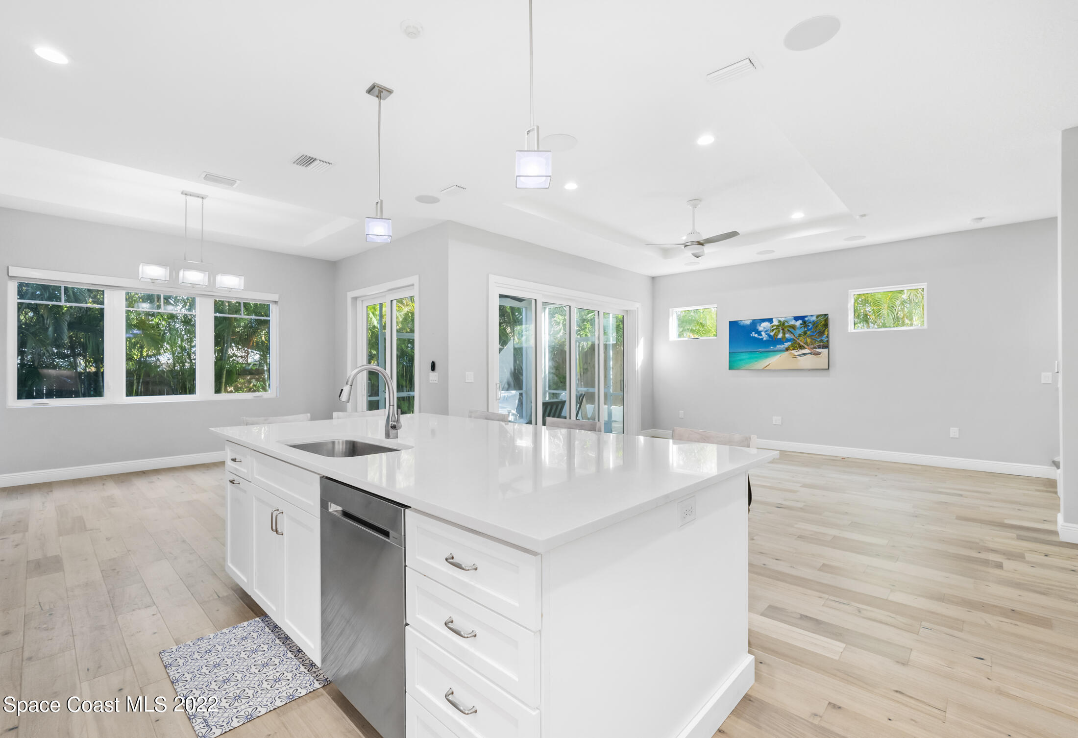 151 24th Street Cocoa Beach, FL 32931 - Photo 2 of 36 a kitchen with kitchen island a sink appliances and a counter space