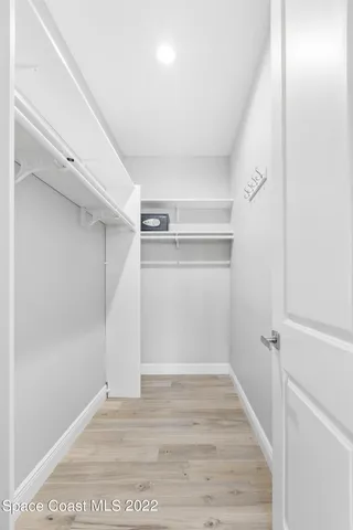 a view of an empty walk in closet