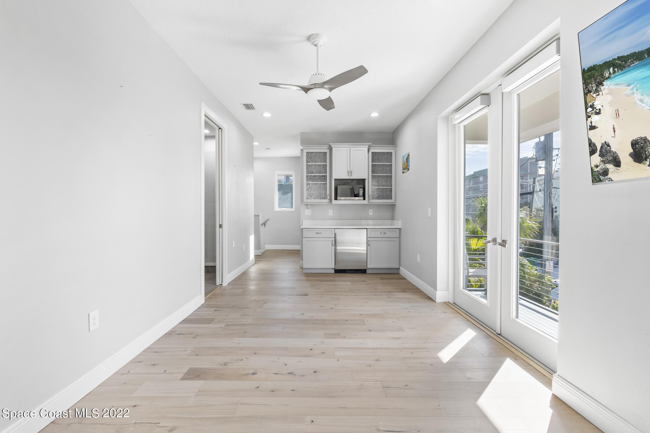 151 24th Street Cocoa Beach, FL 32931 - Photo 29 of 36 a view of a kitchen with a sink and a refrigerator