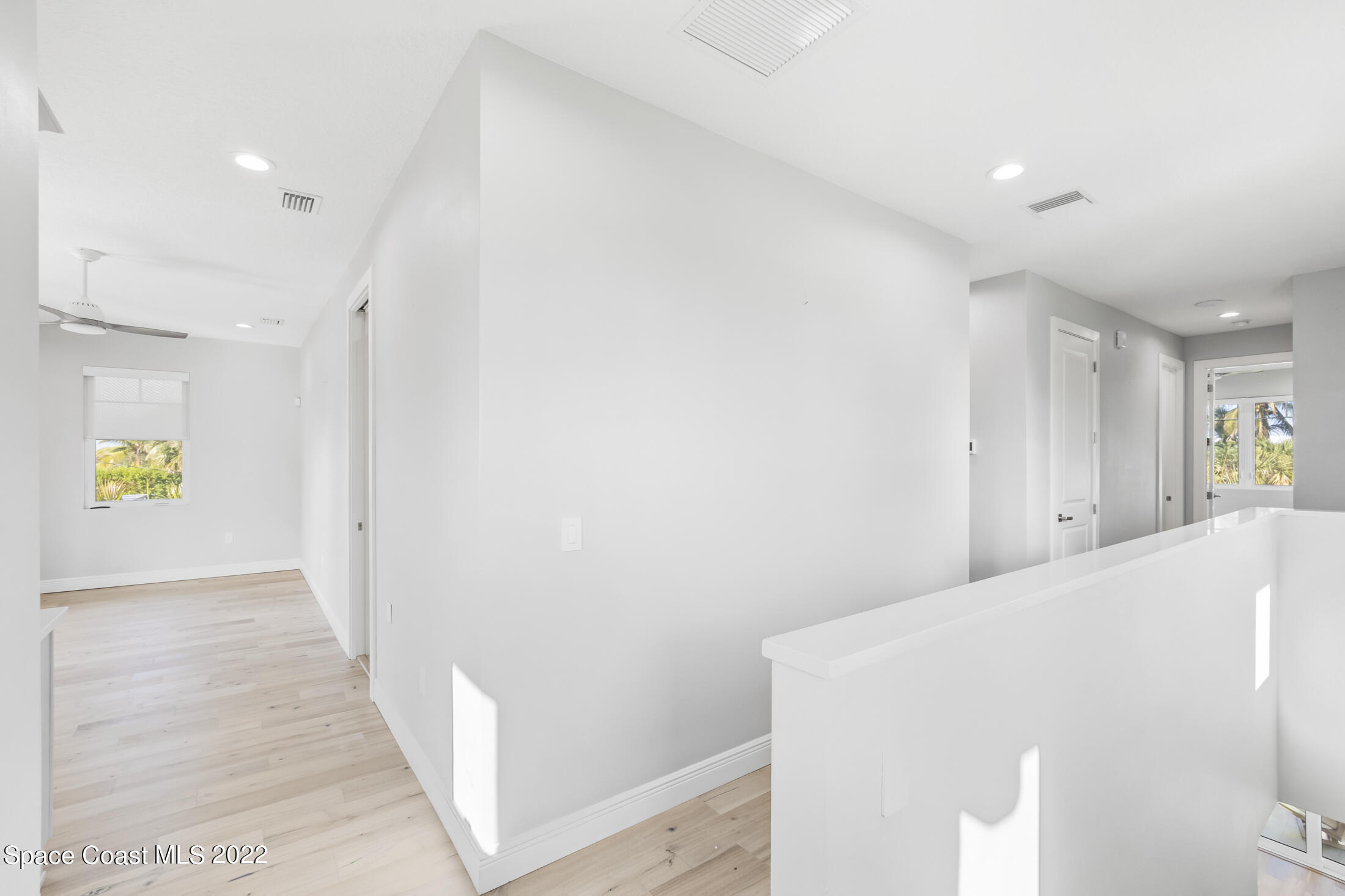 151 24th Street Cocoa Beach, FL 32931 - Photo 31 of 36 a view of hallway with wooden floor