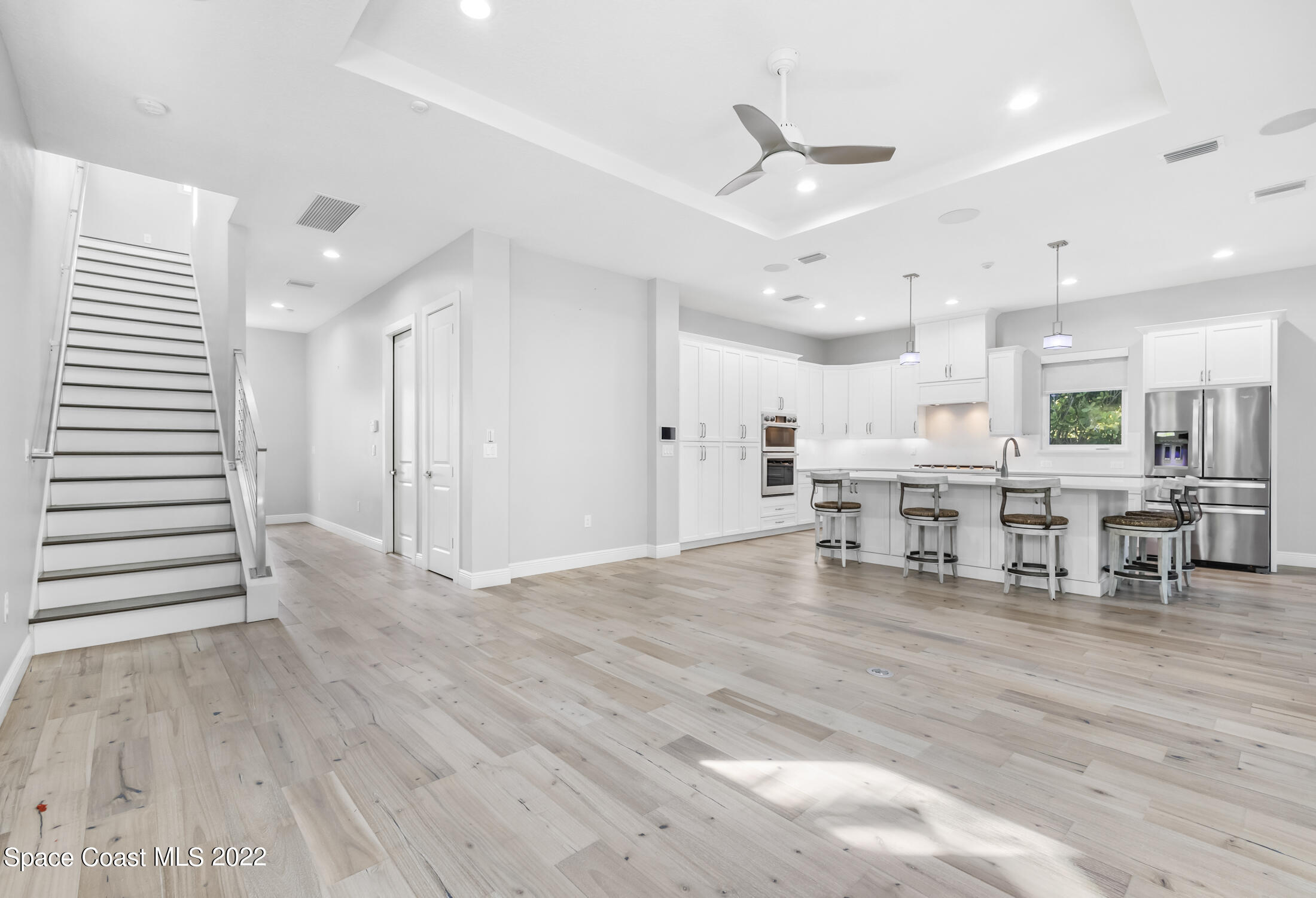 151 24th Street Cocoa Beach, FL 32931 - Photo 6 of 36 a living room with furniture and wooden floor