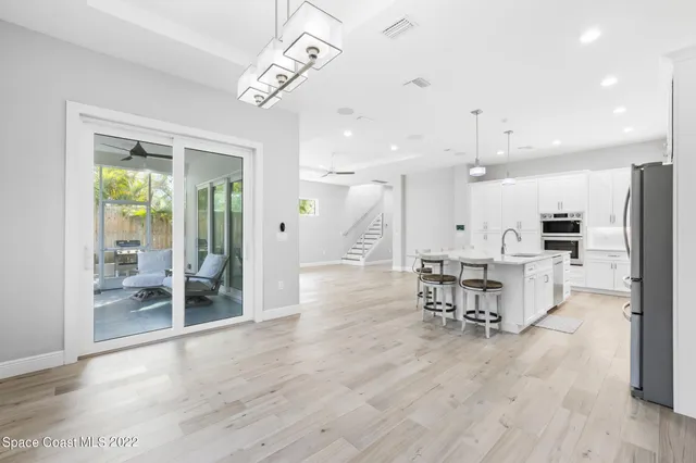 a view of a kitchen with dining table and chairs