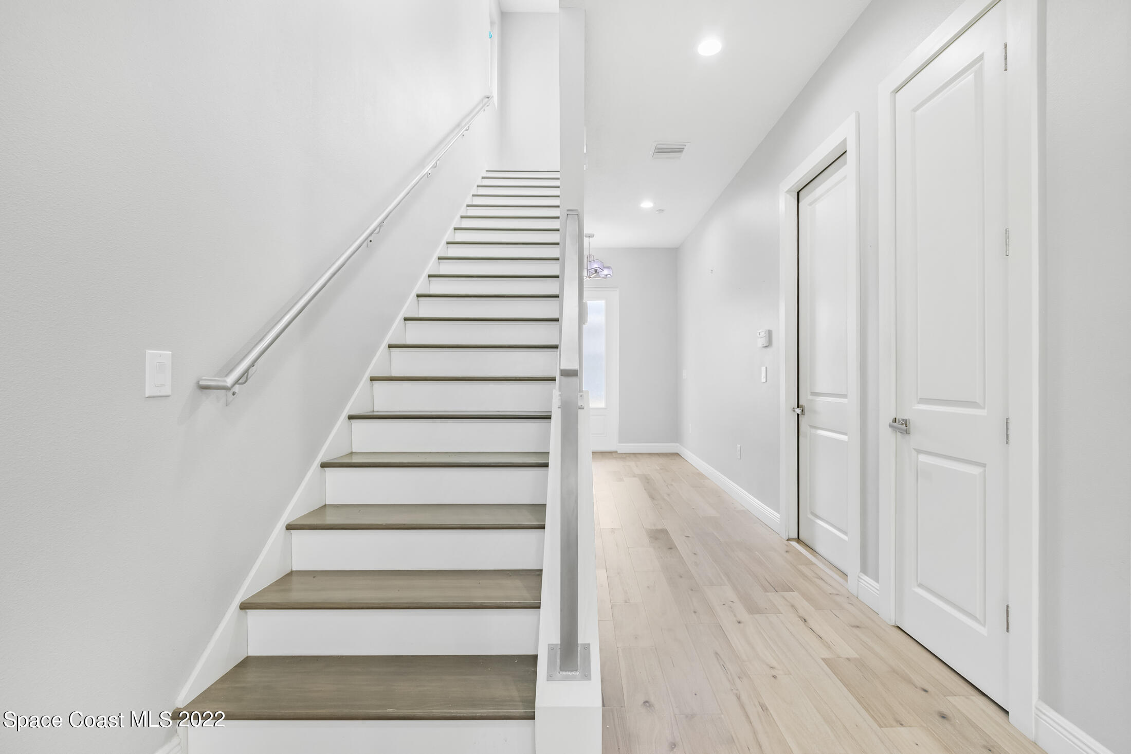 151 24th Street Cocoa Beach, FL 32931 - Photo 10 of 36 a view of an entryway with wooden floor