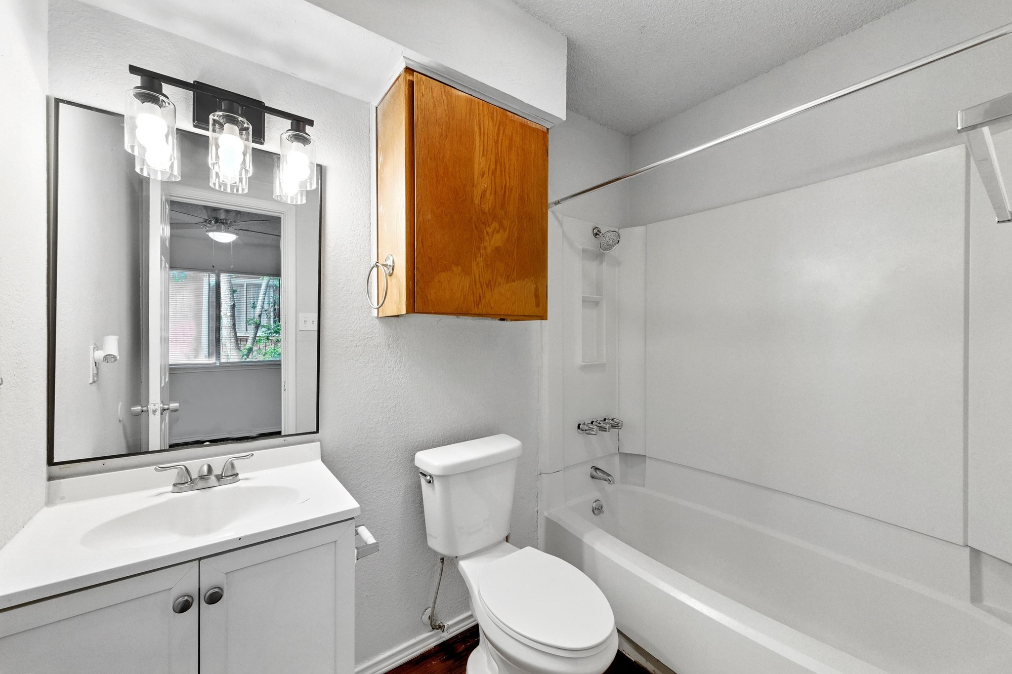 5707 Spring Meadow Road Austin, TX 78744 - Photo 16 of 21 a bathroom with a sink toilet and shower