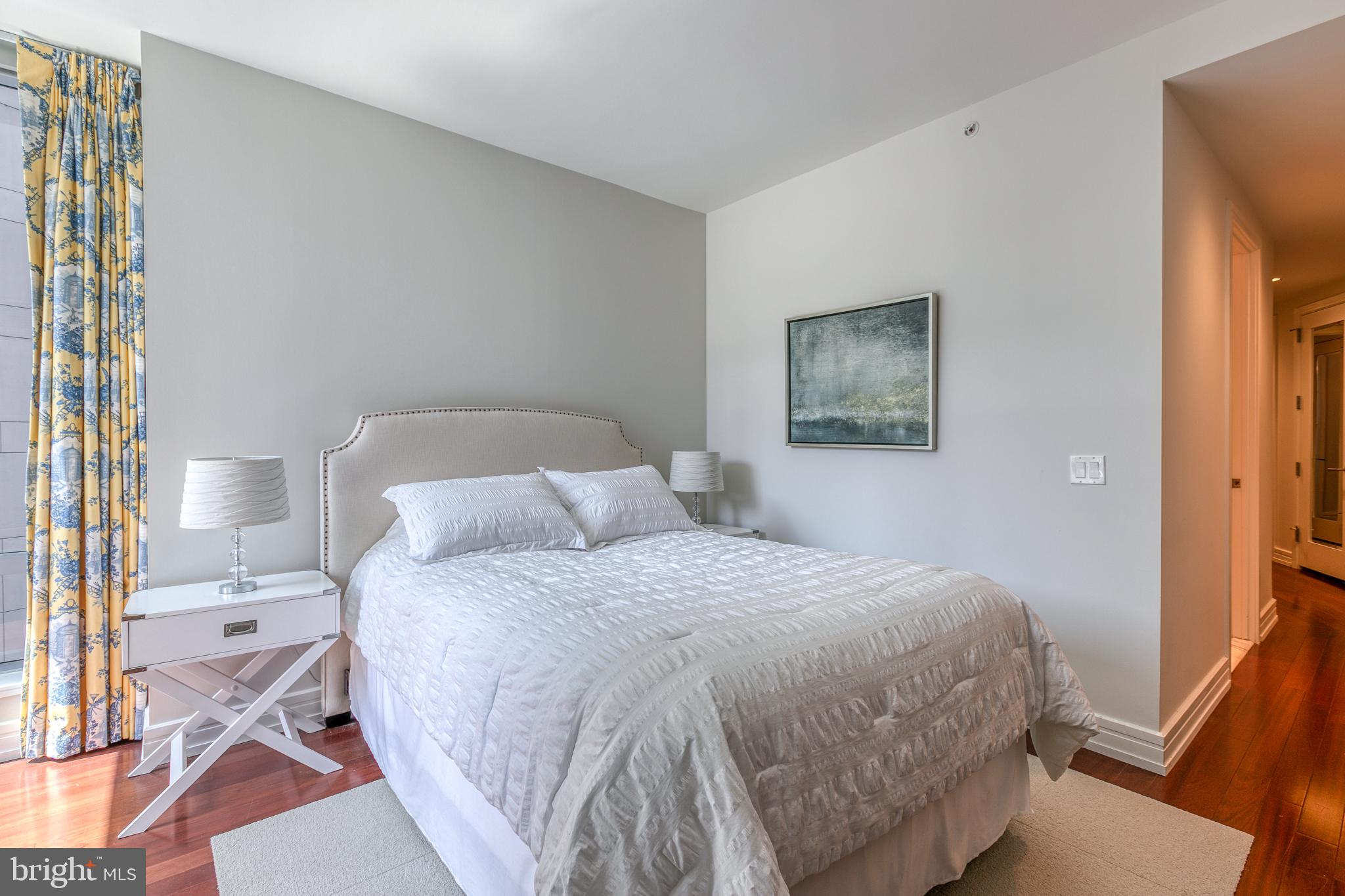 1414 South Penn Square, Unit 16A Philadelphia, PA 19102 - Photo 13 of 34 a bedroom with a bed and a painting on the wall