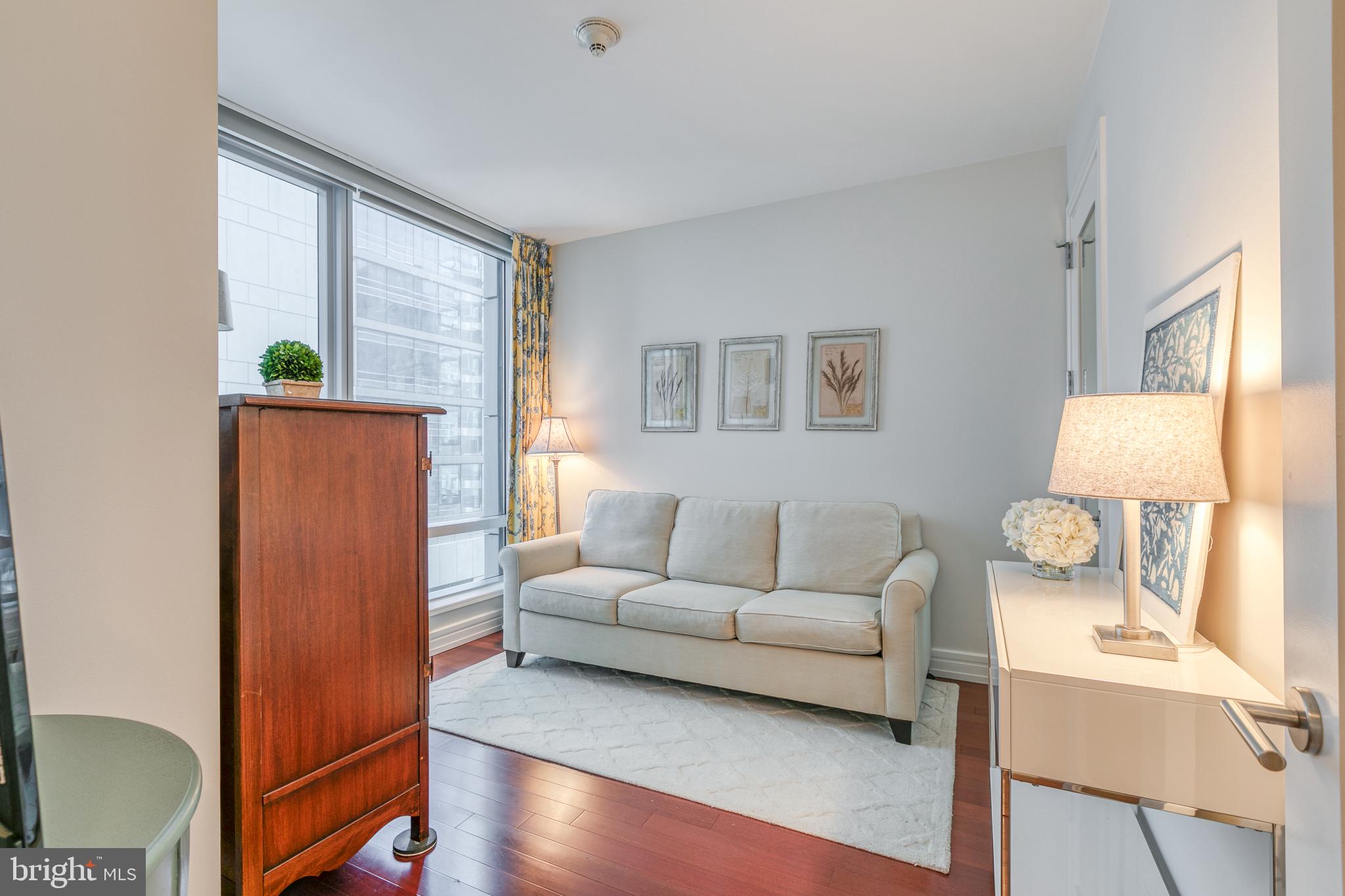 1414 South Penn Square, Unit 16A Philadelphia, PA 19102 - Photo 17 of 34 a living room with furniture and a window