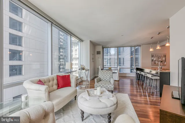 a living room with furniture and a large window