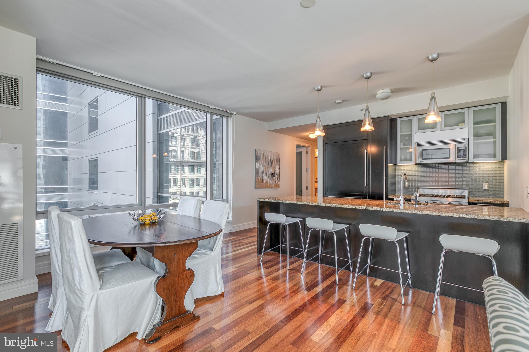 1414 South Penn Square, Unit 16A Philadelphia, PA 19102 - Photo 6 of 34 a large kitchen with a table and chairs