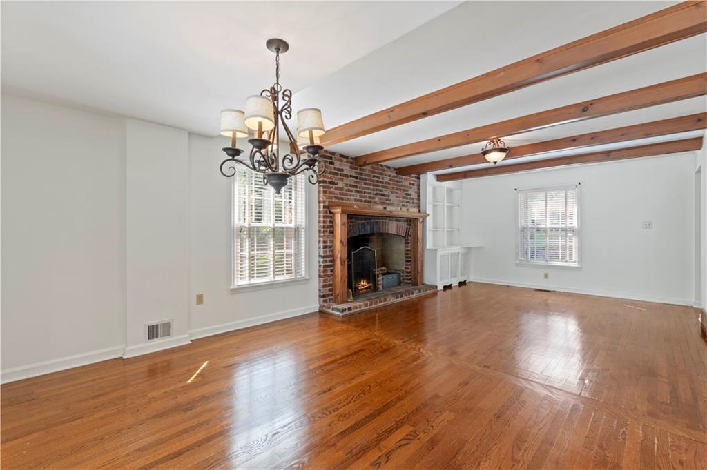 24 Oakglen Drive Oakmont, PA 15139 - Photo 13 of 50 a view of a livingroom with wooden floor a fireplace and windows