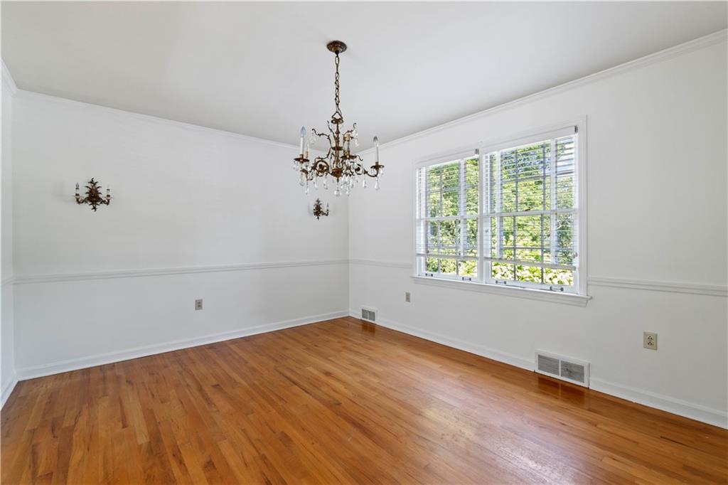 24 Oakglen Drive Oakmont, PA 15139 - Photo 15 of 50 a view of a room with wooden floor and chandelier