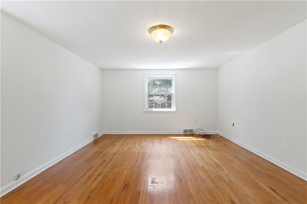 24 Oakglen Drive Oakmont, PA 15139 - Photo 20 of 50 an empty room with wooden floor and windows