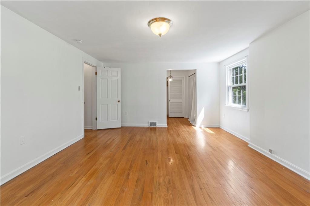24 Oakglen Drive Oakmont, PA 15139 - Photo 21 of 50 an empty room with wooden floor and windows