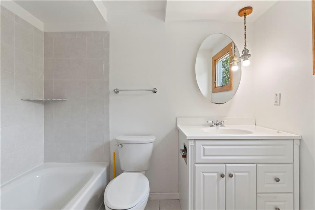 24 Oakglen Drive Oakmont, PA 15139 - Photo 23 of 50 a bathroom with a sink a toilet and a mirror