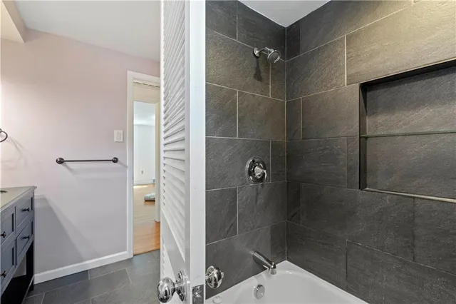 a bathroom with a shower and toilet