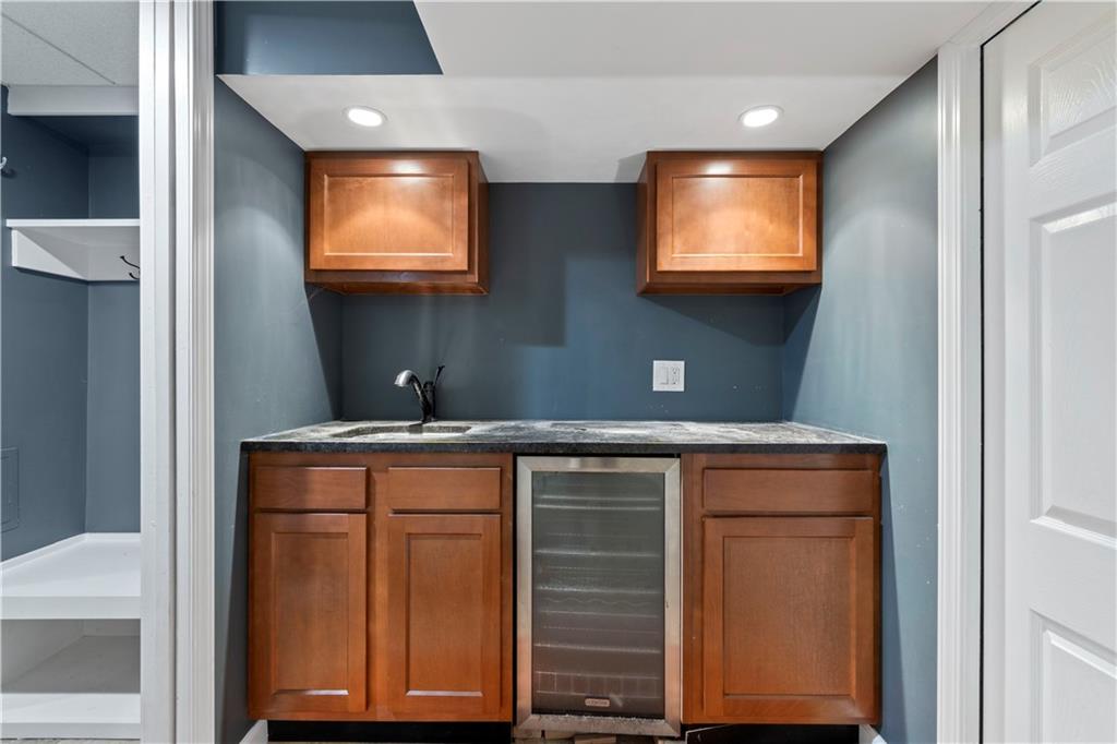 24 Oakglen Drive Oakmont, PA 15139 - Photo 37 of 50 a room with stainless steel appliances granite countertop a sink and a microwave