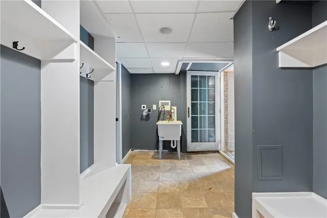 a view of a hallway with bathroom and wooden floor