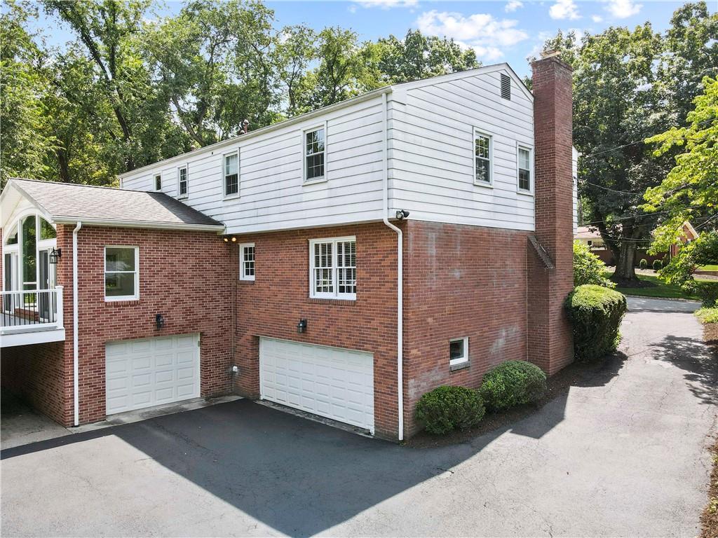 24 Oakglen Drive Oakmont, PA 15139 - Photo 45 of 50 a front view of a house with a garden