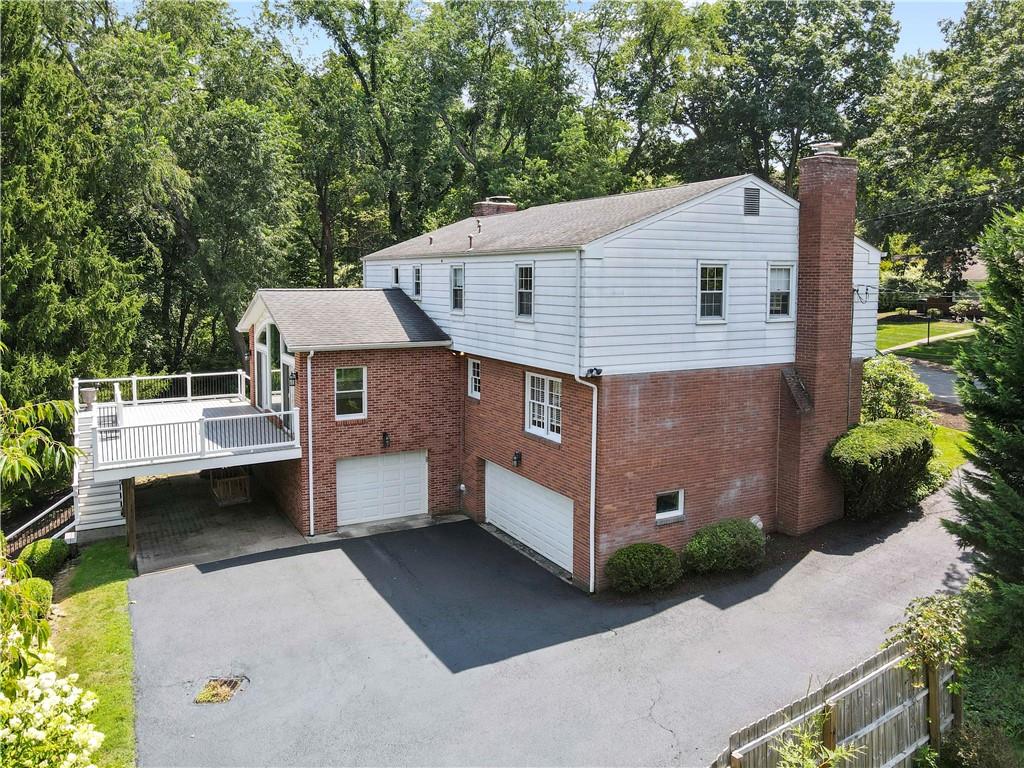 24 Oakglen Drive Oakmont, PA 15139 - Photo 46 of 50 a view of a house with a yard plants and large tree