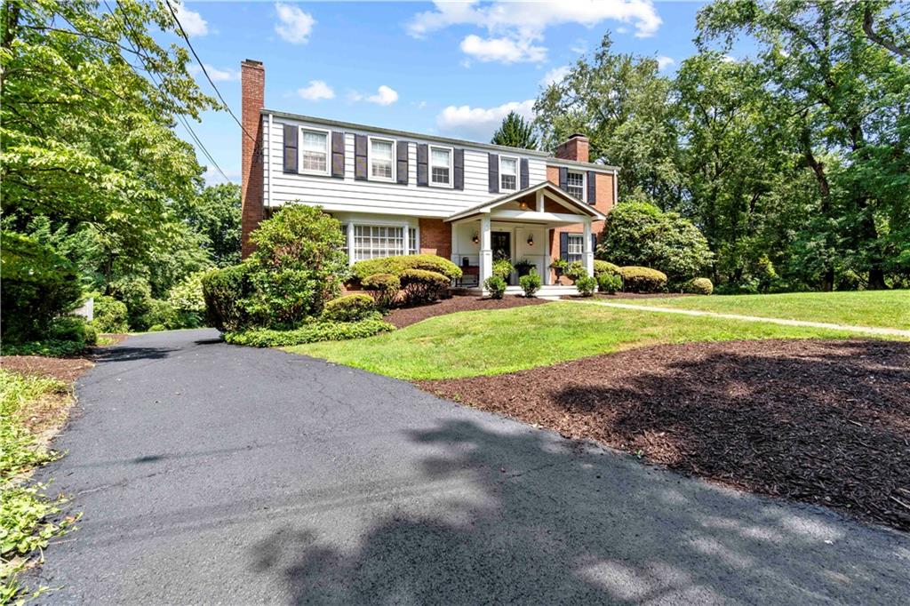 24 Oakglen Drive Oakmont, PA 15139 - Photo 49 of 50 a front view of a house with a yard and garage