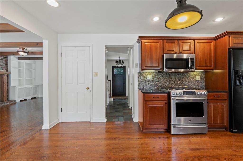 24 Oakglen Drive Oakmont, PA 15139 - Photo 9 of 50 a kitchen with stainless steel appliances granite countertop a stove and a microwave