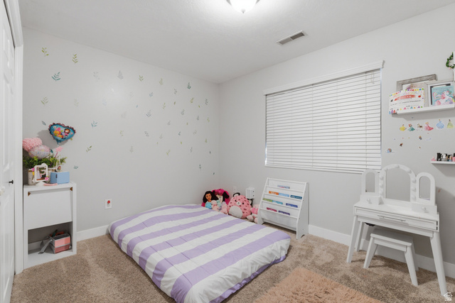 282 West 960 South, Unit C Provo, UT 84601 - Photo 22 of 33 Bedroom featuring light colored carpet and wallpapered walls