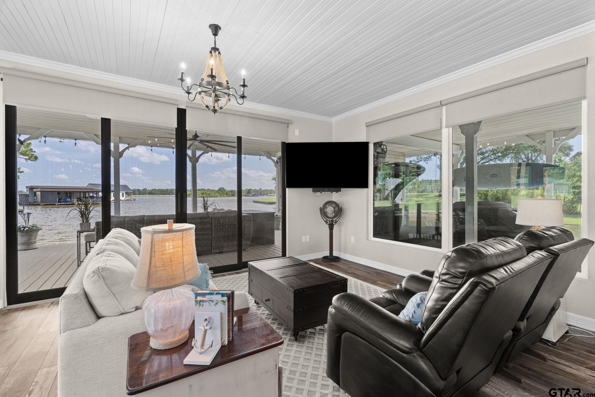 17790 Southpoint Road Whitehouse, TX 75791 - Photo 18 of 44 a living room with furniture a flat screen tv and a large window