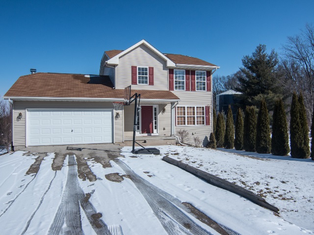 306 Rochester Road Northeast Poplar Grove, IL 61065 - Photo 1 of 25 a front view of a house with a yard