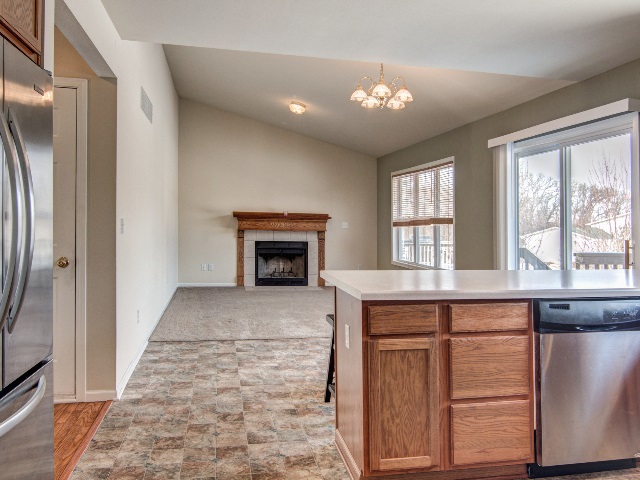 306 Rochester Road Northeast Poplar Grove, IL 61065 - Photo 11 of 25 a living room with a fireplace and a window