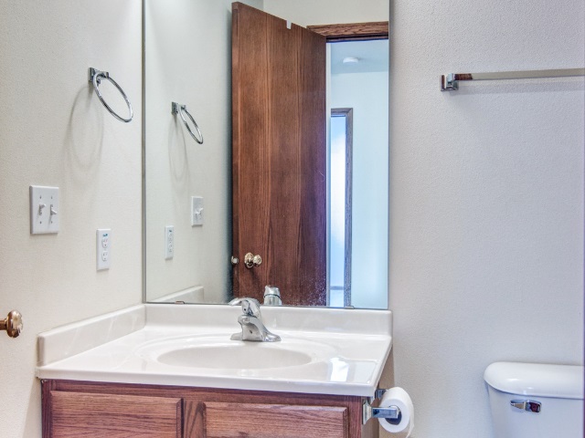 306 Rochester Road Northeast Poplar Grove, IL 61065 - Photo 14 of 25 a bathroom with a sink and a mirror