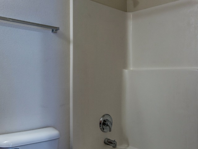 306 Rochester Road Northeast Poplar Grove, IL 61065 - Photo 15 of 25 a bathroom with a toilet and a shower