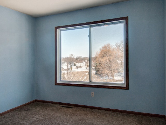 306 Rochester Road Northeast Poplar Grove, IL 61065 - Photo 24 of 25 an empty room with a window