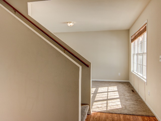 306 Rochester Road Northeast Poplar Grove, IL 61065 - Photo 4 of 25 a view of empty room with windows