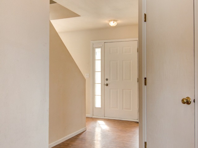 306 Rochester Road Northeast Poplar Grove, IL 61065 - Photo 5 of 25 a view of empty room with wooden floor and fan