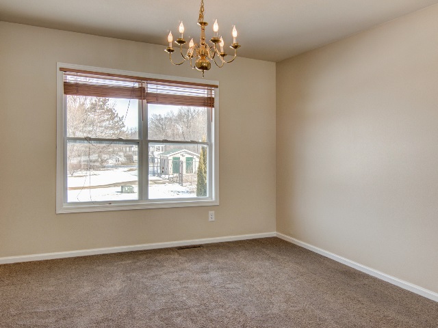 306 Rochester Road Northeast Poplar Grove, IL 61065 - Photo 8 of 25 an empty room with a window