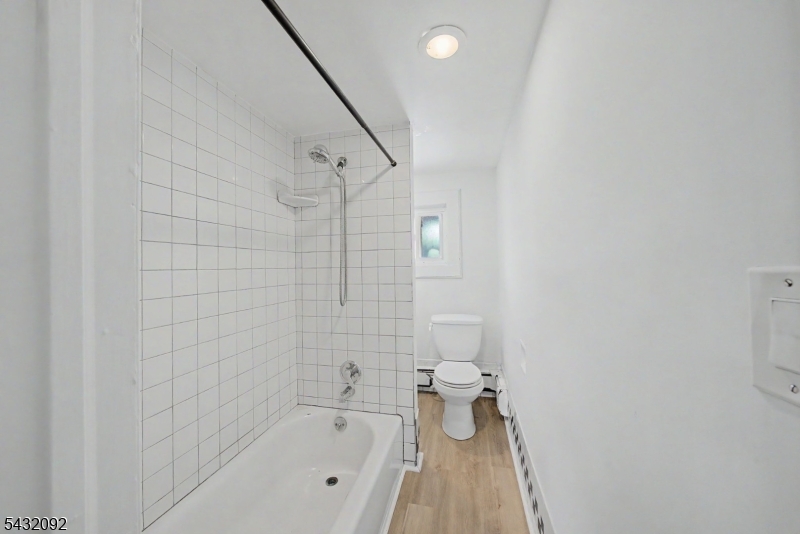 309 Main Street, Unit 3 Boonton, NJ 07005 - Photo 11 of 17 a bathroom with a bathtub and toilet