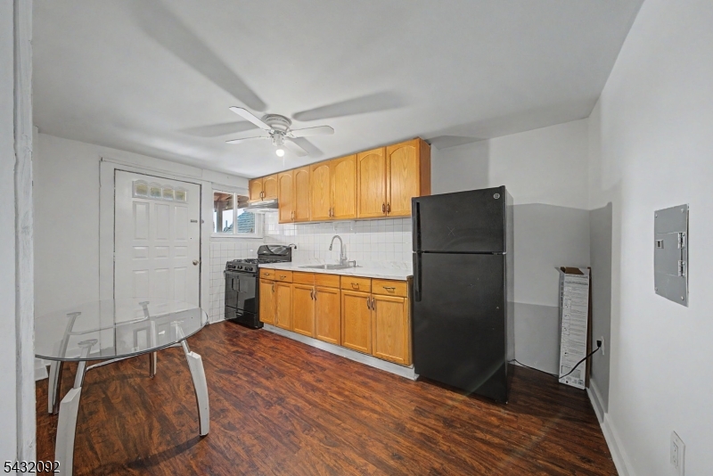309 Main Street, Unit 3 Boonton, NJ 07005 - Photo 2 of 17 a kitchen with a refrigerator cabinets and wooden floor