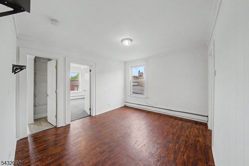 309 Main Street, Unit 3 Boonton, NJ 07005 - Photo 9 of 17 wooden floor in an empty room