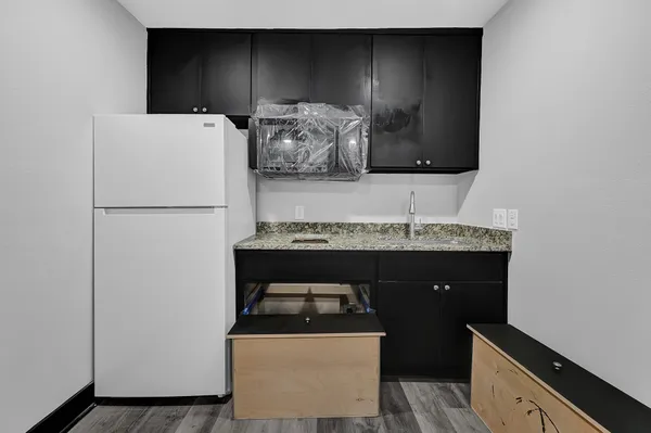 a utility room with sink dryer and washer
