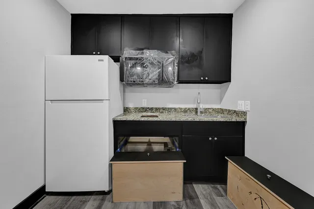 a utility room with sink dryer and washer
